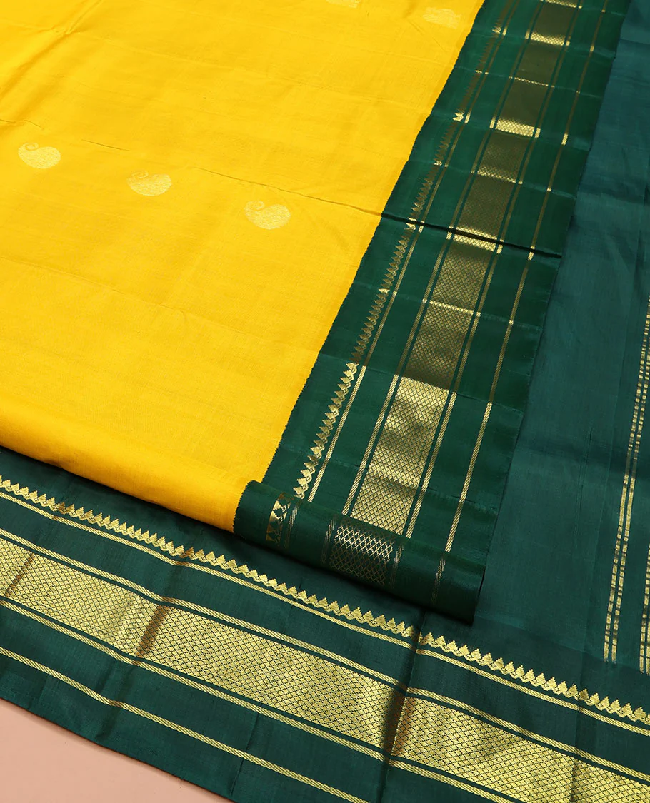 Yellow Kanchipuram Silk Saree, Adorned with Manga and Mayil Buttas, Complemented by Contrast One-Sided Korvai Border of Thilakam Mokku, Banaras, and Kuyil Kann Designs, Pallu Steeped with Mayil Designs, and Comes Without a Blouse - Image 2