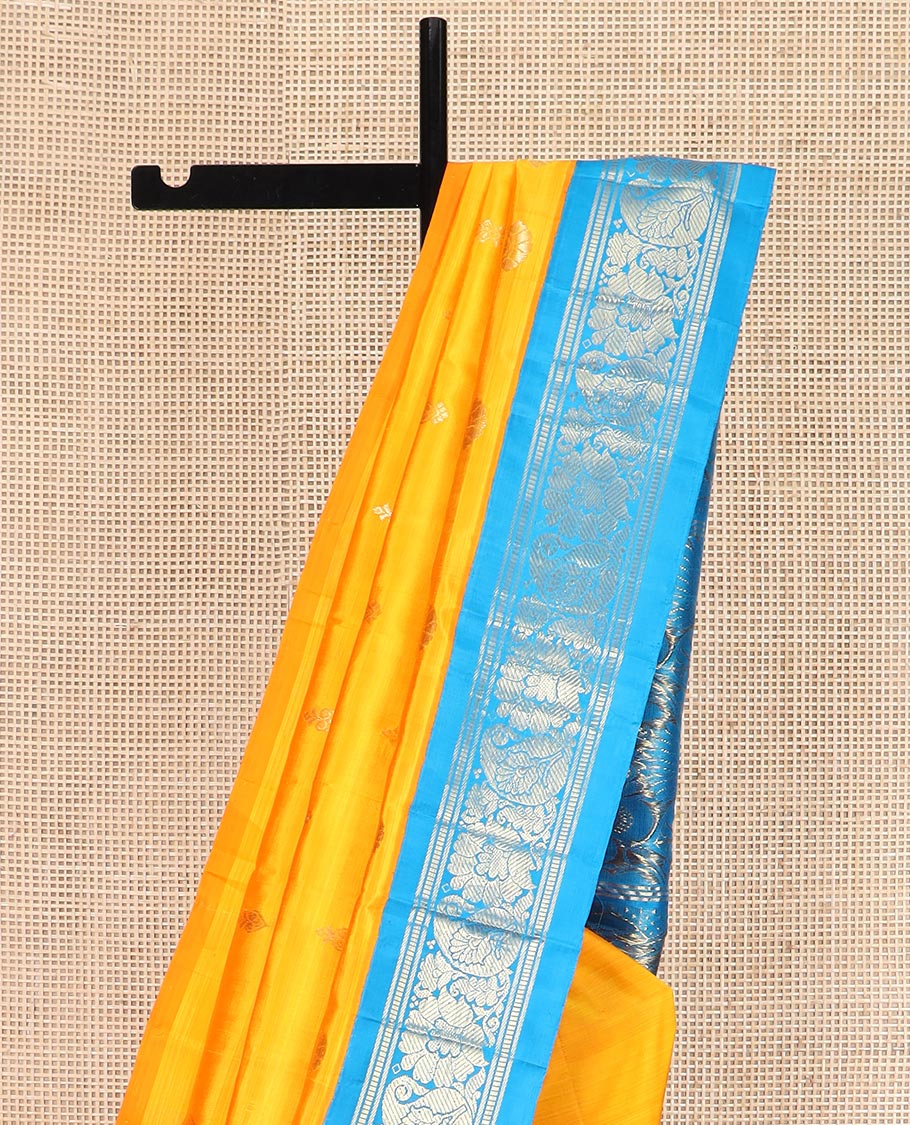 Yellow Kanchipuram Silk Saree Sparsely Sparkled with Zari Buttas All Over Its Body, Complemented by a Contrast One-Sided Korvai Border of Banaras, Muthu, Manga, and Floral Designs, Pallu of Floral Designs, and Comes Without a Blouse - Image 3