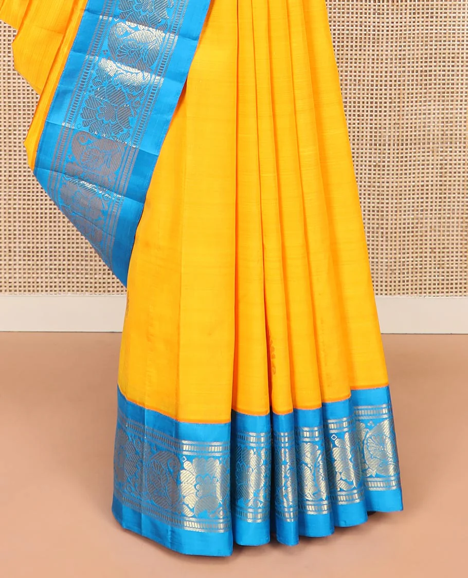 Yellow Kanchipuram Silk Saree Sparsely Sparkled with Zari Buttas All Over Its Body, Complemented by a Contrast One-Sided Korvai Border of Banaras, Muthu, Manga, and Floral Designs, Pallu of Floral Designs, and Comes Without a Blouse - Image 4