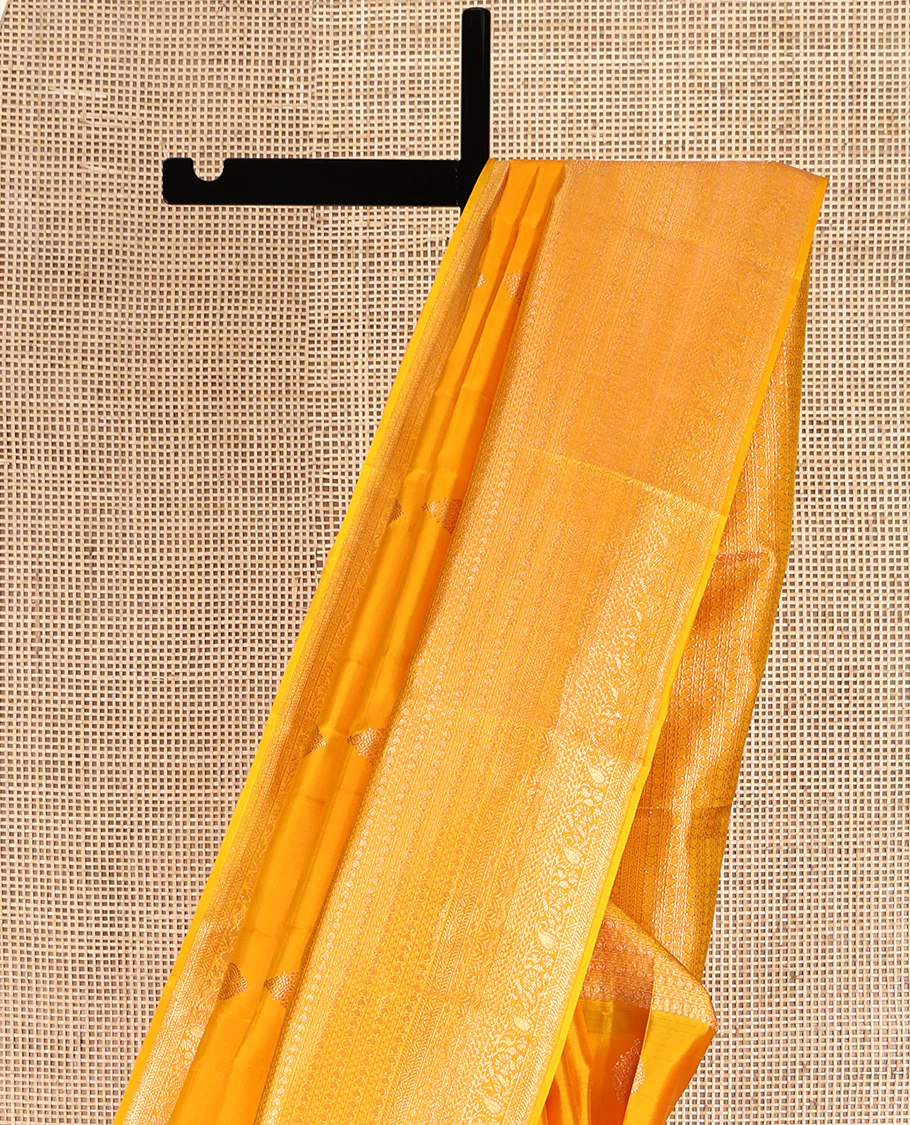 Yellow Kanchipuram Silk Saree, Subtly Sparkled with Zari Buttas All Over Its Body, Highlighted by a Zari Traditional Design Border, Grand Pallu, and Paired with a Matching Blouse - Image 3