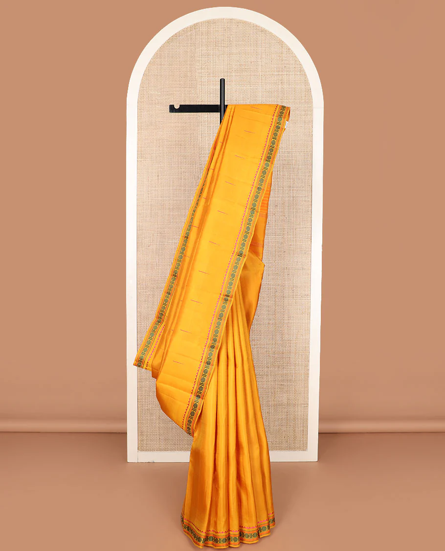 Yellow malli mokku buttas Kanchipuram silk saree, self-border of rekku, muthu, kathir, and rudraksham motifs, and seppu rekku pallu