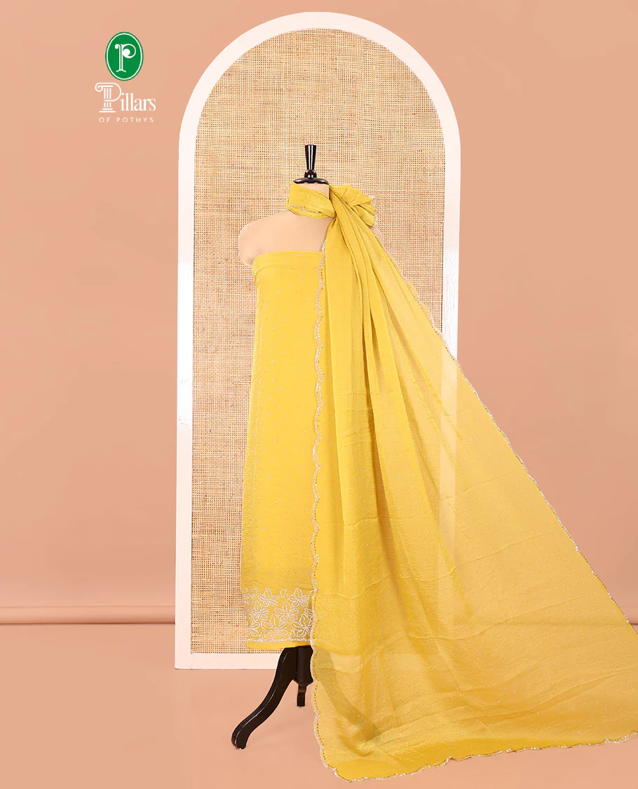 Yellow Moss Organza Material Churidar Set, Embellished with Floral Embroidery and Stone Struck on Its Top, a Plain Santoon Bottom, and Paired with a Moss Organza Stone Work Scallop Dupatta