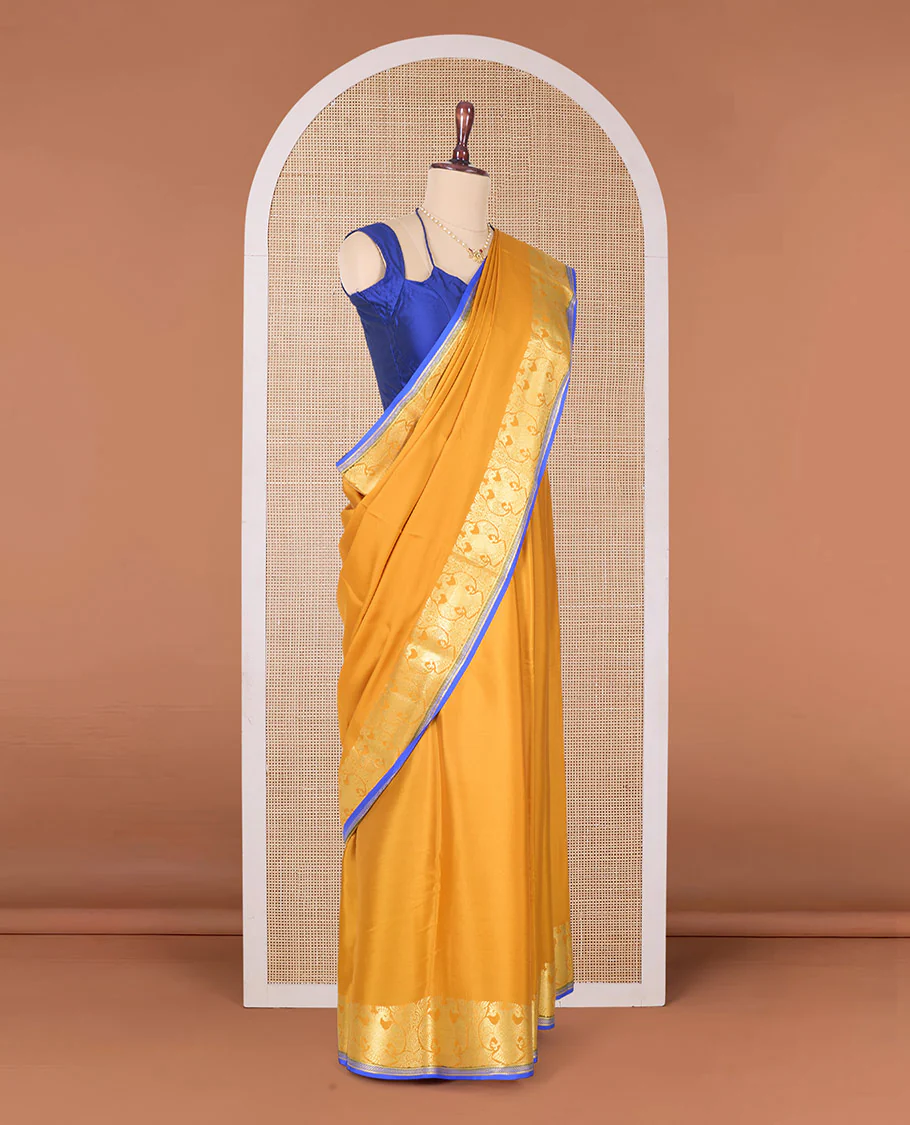 Yellow plain Mysore silk saree, two-headed eagle zari border, and pallu steeped with two-headed eagle motifs