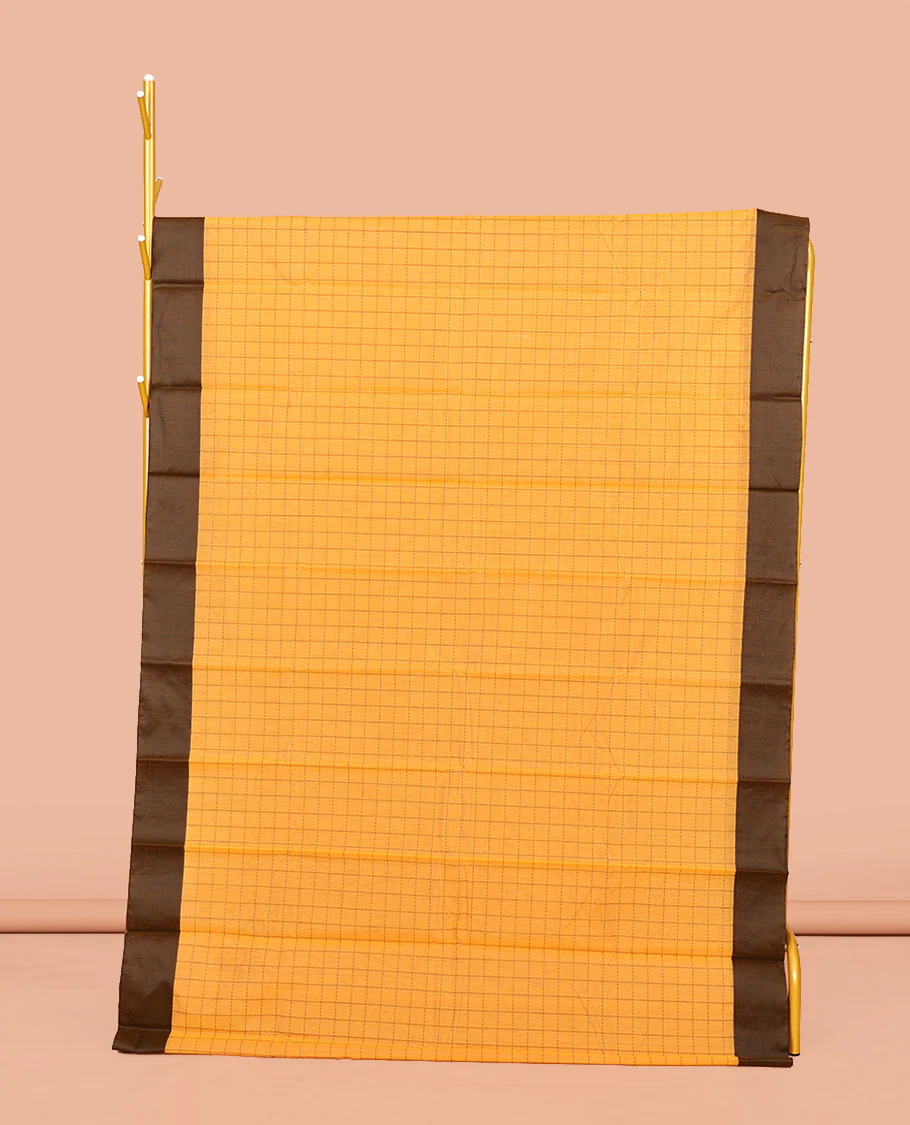 Yellow Semi-Silk Cotton Saree, Sparsely Threaded with Checks All Over Its Body, Complemented by a Contrast Border, Striped Pallu, and Paired with a Matching Blouse
