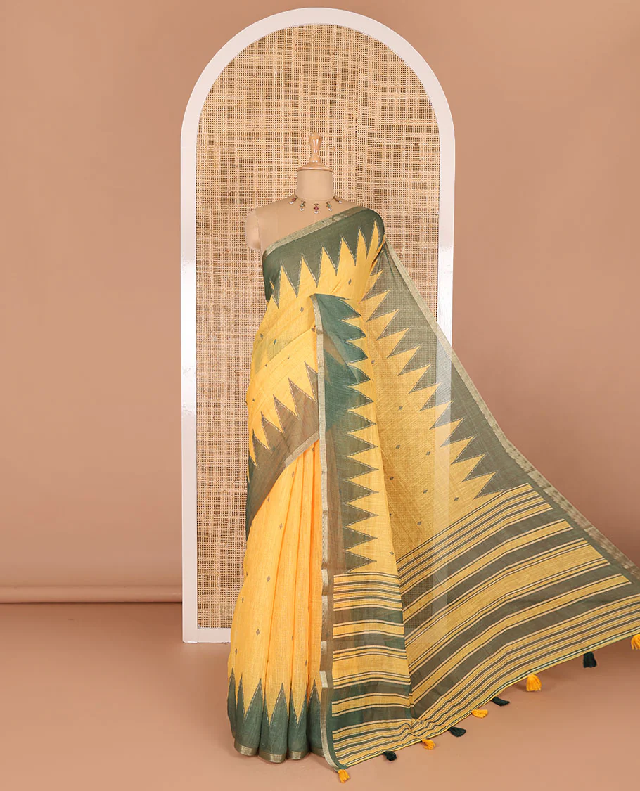 Yellow small thread buttas linen cotton saree, contrast temple zari piping border, striped pallu and a contrast blouse