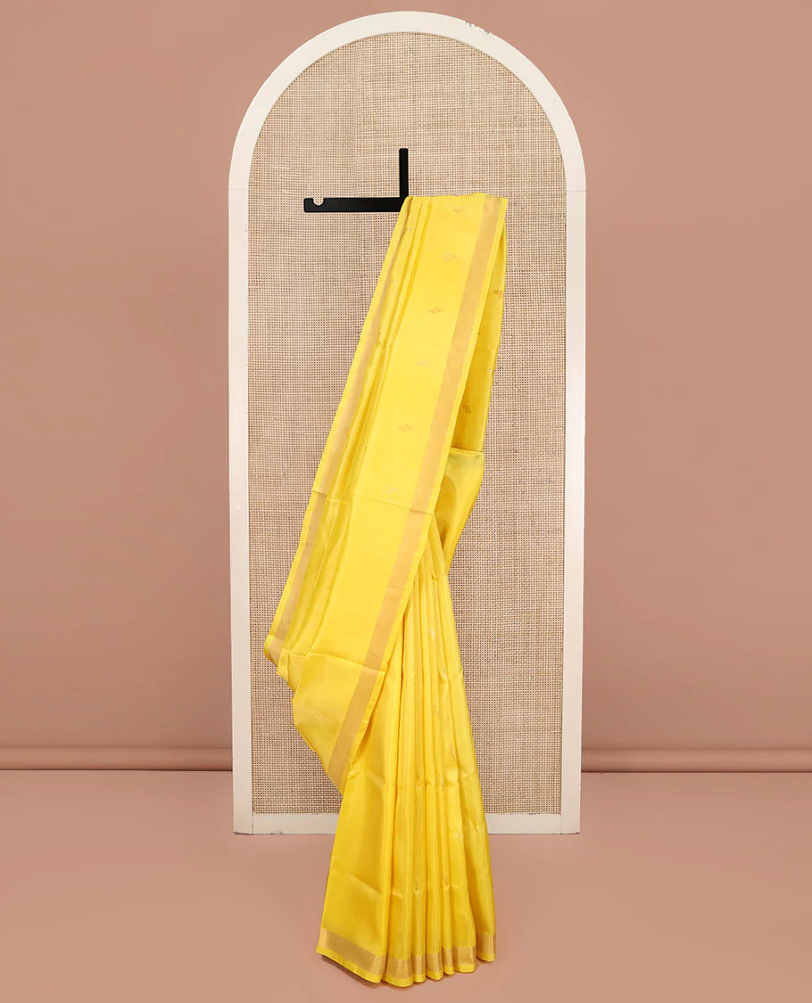 Yellow Uppada Silk Saree, Sparsely Woven with Buttas All Over Its Body, Subtle Bavanji Border, Pallu Steeped with Paisley Buttas, and Paired with a Matching Blouse