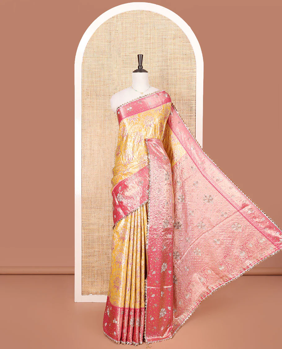 Yellow Vastrakala Silk Saree, Decked up with Floral Jacquard and Stone Work, Complemented by Contrast Traditional Zari and Cut Embroidered Scallop Border, Gleaming Grand Zari-Stone Work Pallu, and Paired with Contrast Heavy Stone Embroidered Blouse