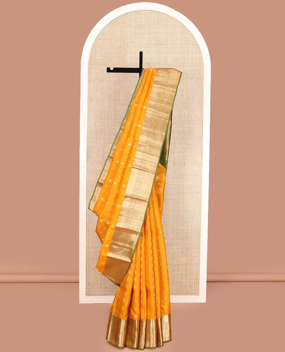 Yellow Vasundhara Lite Silk Mix Saree, Subtly Sparkled with Zari Buttas, Complemented by a Contrast Border of Thilakam Mokku, Muthu, Kodi Visiry, Diamond, and Kuyil Kann Designs, Beautifully Bedecked Pallu, and Paired with a Contrast Blouse