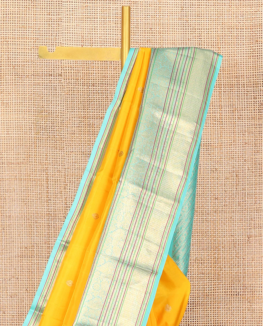 Yellow Vasundhara Silk Saree Decorated with Zari Buttas All Over Its Body, Complemented by a Contrast Border of Leaf, Rudraksham, Diamond, and Mayil Kann Designs, Pallu Featuring Manga Creeper Designs, and Paired with a Contrast Blouse - Image 2
