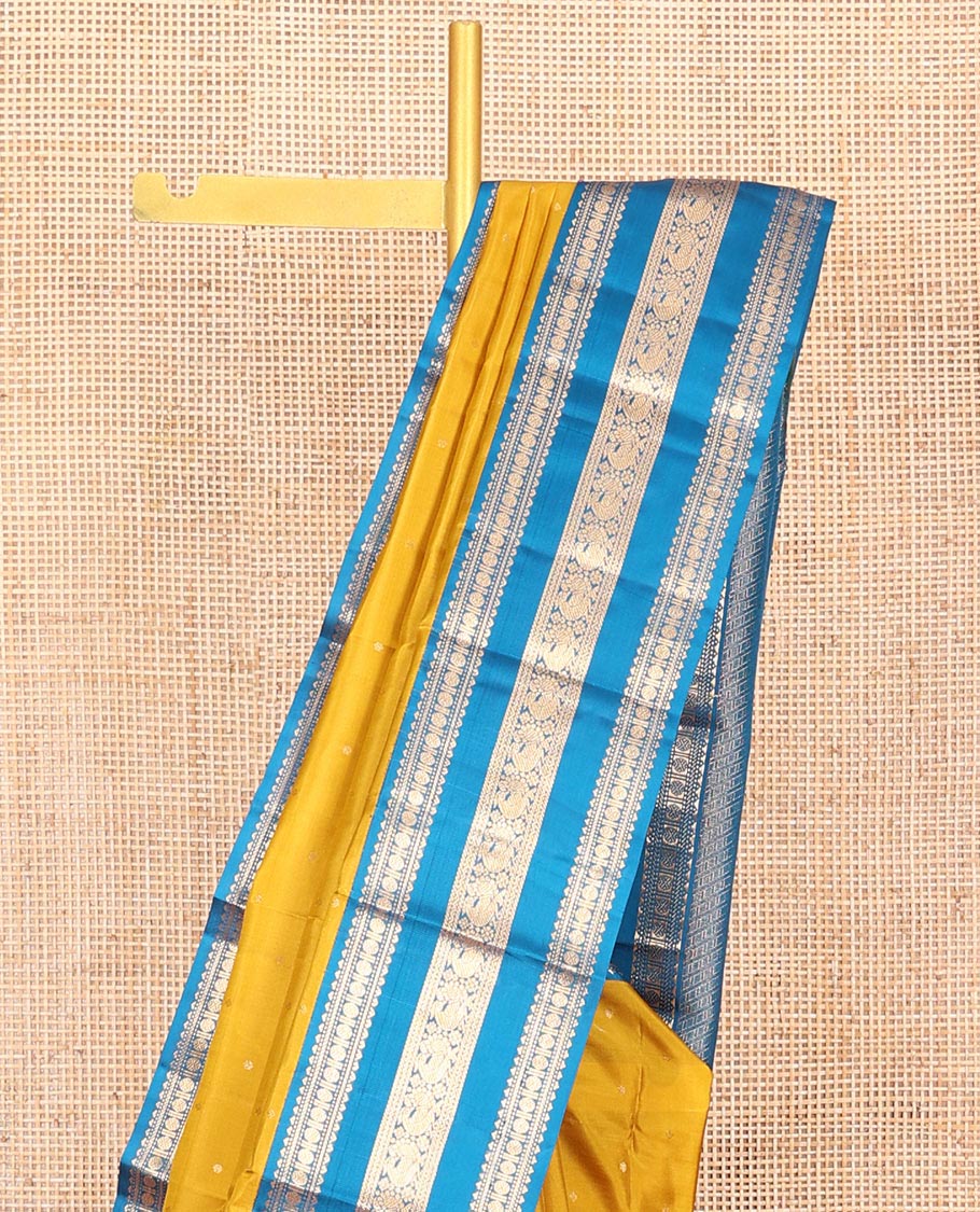 Yellow Vasundhara Silk Saree, Embellished with Zari Buttas All Over Its Body, Complemented by a Contrast Border of Rekku, Banaras, Rudraksham, Neli, and Mayil Designs, Grand Pallu of Geometric Patterns, and Paired with a Contrast Blouse - Image 2