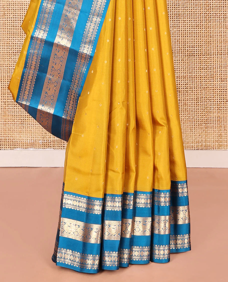 Yellow Vasundhara Silk Saree, Embellished with Zari Buttas All Over Its Body, Complemented by a Contrast Border of Rekku, Banaras, Rudraksham, Neli, and Mayil Designs, Grand Pallu of Geometric Patterns, and Paired with a Contrast Blouse - Image 4