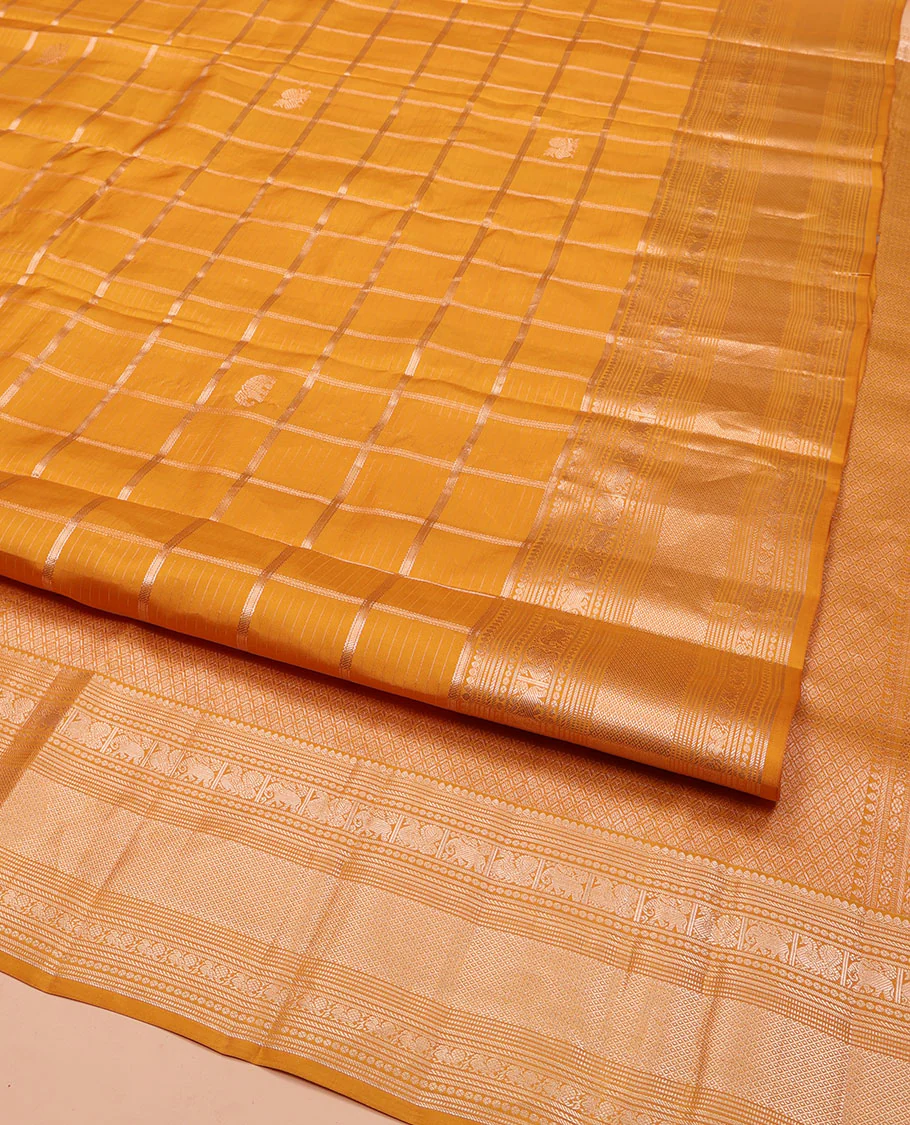 Yellow Vasundhara Silk Saree, Enriched with Zari Butta Enclosed Checked Design All Over Its Body, Highlighted by Zari Border of Thilakam Mokku, Muthu, Mayil, Yaanai, and Mayil Kann Designs, Grand Jaal Pallu, and Paired with a Matching Blouse - Image 2