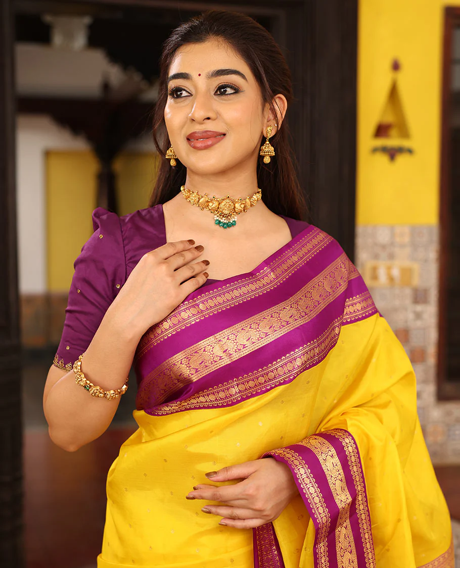 Yellow Vasundhara Silk Saree Finely Woven with Zari Buttas, Complemented with Varisai Pettu Border Featuring Rekku, Muthu, Banaras, Rudraksham, and Mayil Designs, Majestically Zari-Woven Pallu, and a Contrast Blouse - Image 3