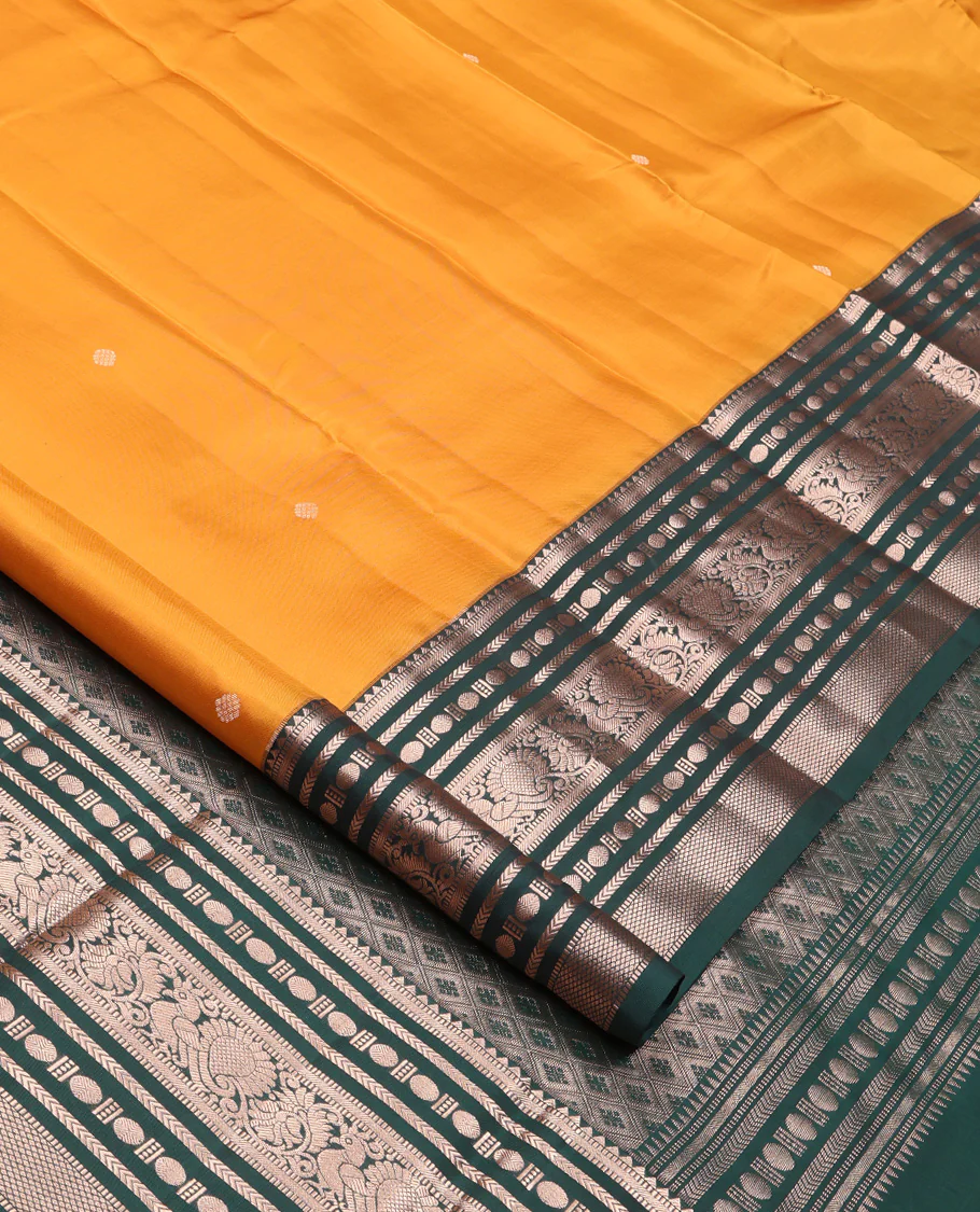 Yellow Vasundhara Silk Saree, Prettified with Zari Buttas All Over Its Body, Complemented by Contrast Border of Rekku, Muthu, Kathir, Poun, Mayil, and Mayil Kann Designs, Grand Jaal Pallu and Paired with a Contrast Blouse - Image 2