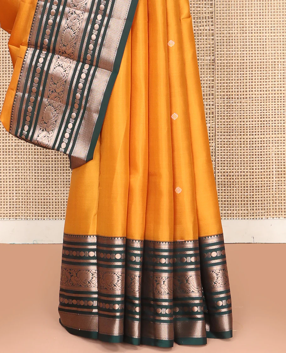 Yellow Vasundhara Silk Saree, Prettified with Zari Buttas All Over Its Body, Complemented by Contrast Border of Rekku, Muthu, Kathir, Poun, Mayil, and Mayil Kann Designs, Grand Jaal Pallu and Paired with a Contrast Blouse - Image 4