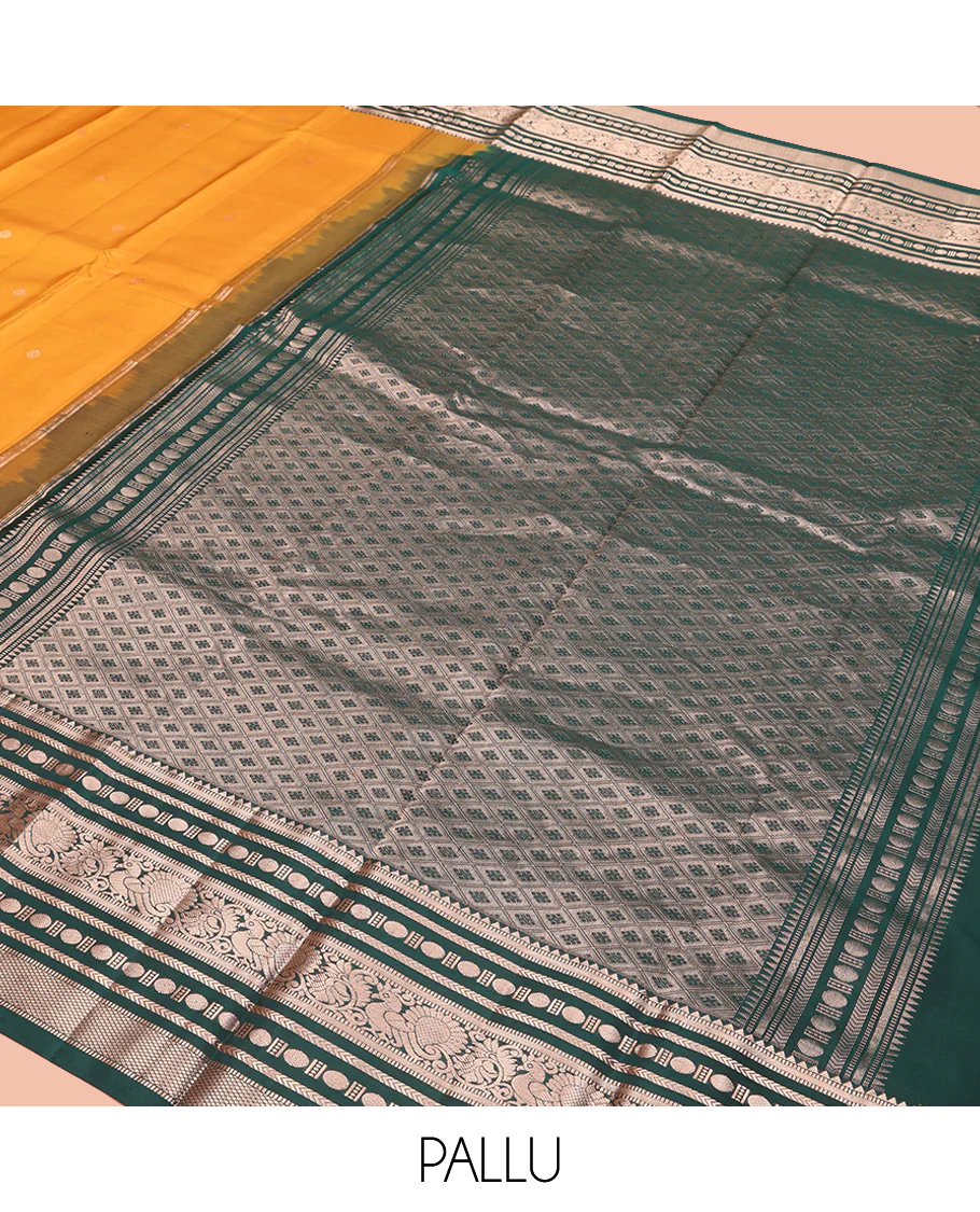 Yellow Vasundhara Silk Saree, Prettified with Zari Buttas All Over Its Body, Complemented by Contrast Border of Rekku, Muthu, Kathir, Poun, Mayil, and Mayil Kann Designs, Grand Jaal Pallu and Paired with a Contrast Blouse - Image 5