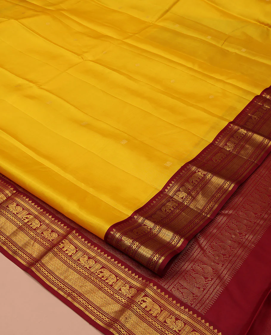 Yellow Vasundhara Silk Saree, Subtly Sparkled with Buttas All Over Its Body, Complemented by a Contrast Border of Thilakam, Neli, Kathir, Mayil, Yaanai, and Mayil Kann Designs, Grand Jaal Pallu, and Paired with a Contrast Blouse - Image 2