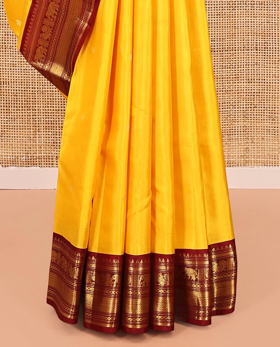 Yellow Vasundhara Silk Saree, Subtly Sparkled with Buttas All Over Its Body, Complemented by a Contrast Border of Thilakam, Neli, Kathir, Mayil, Yaanai, and Mayil Kann Designs, Grand Jaal Pallu, and Paired with a Contrast Blouse - Image 4