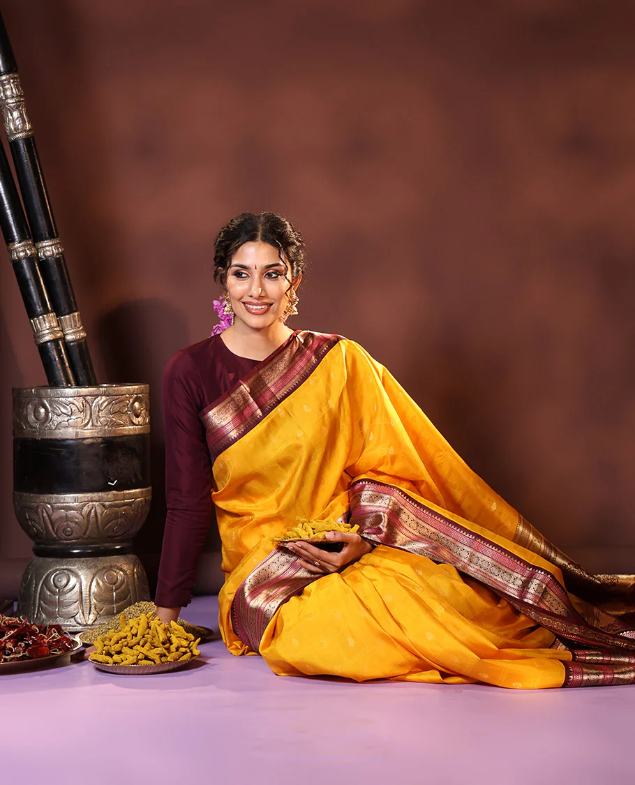Yellow Vasundhara Silk Saree Subtly Sparkled with Buttas Enclosed Checks All Over Its Body, Complemented by Contrast Border of Rekku, Chakram, and Jada Nagam Designs, a Grandly Woven Pallu of Intricate Mughal Designs, and Paired with a Contrast Blouse - Image 3