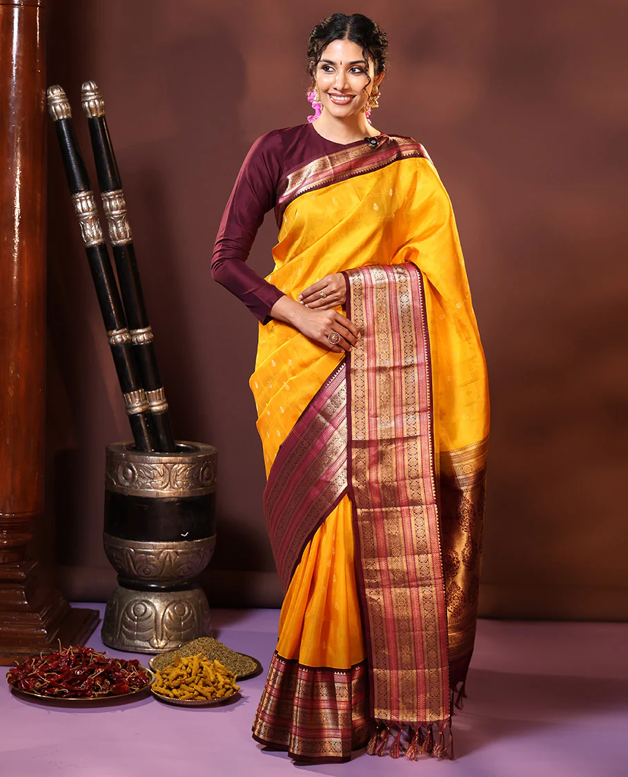 Yellow Vasundhara Silk Saree Subtly Sparkled with Buttas Enclosed Checks All Over Its Body, Complemented by Contrast Border of Rekku, Chakram, and Jada Nagam Designs, a Grandly Woven Pallu of Intricate Mughal Designs, and Paired with a Contrast Blouse - Image 4
