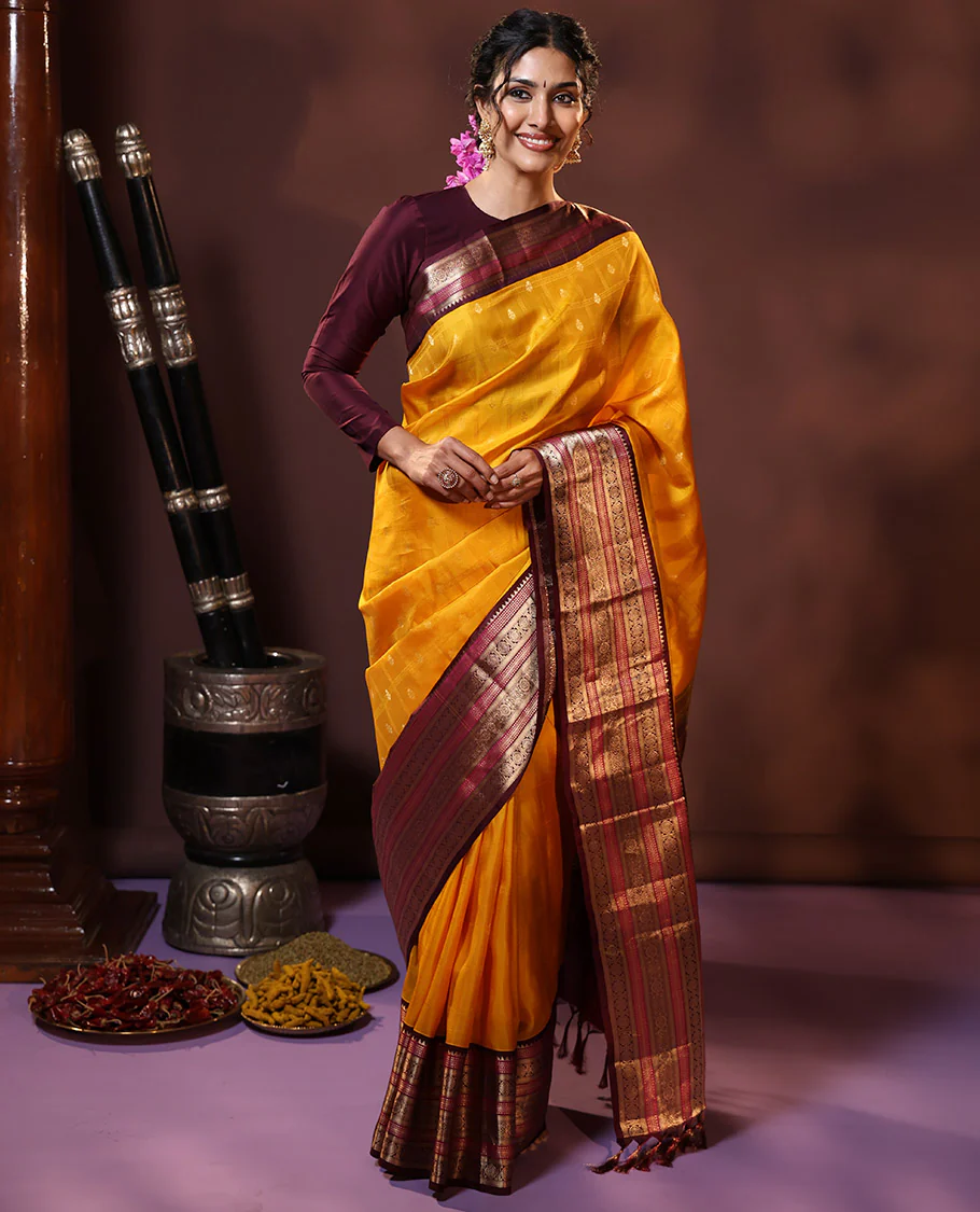 Yellow Vasundhara Silk Saree Subtly Sparkled with Buttas Enclosed Checks All Over Its Body, Complemented by Contrast Border of Rekku, Chakram, and Jada Nagam Designs, a Grandly Woven Pallu of Intricate Mughal Designs, and Paired with a Contrast Blouse - Image 5