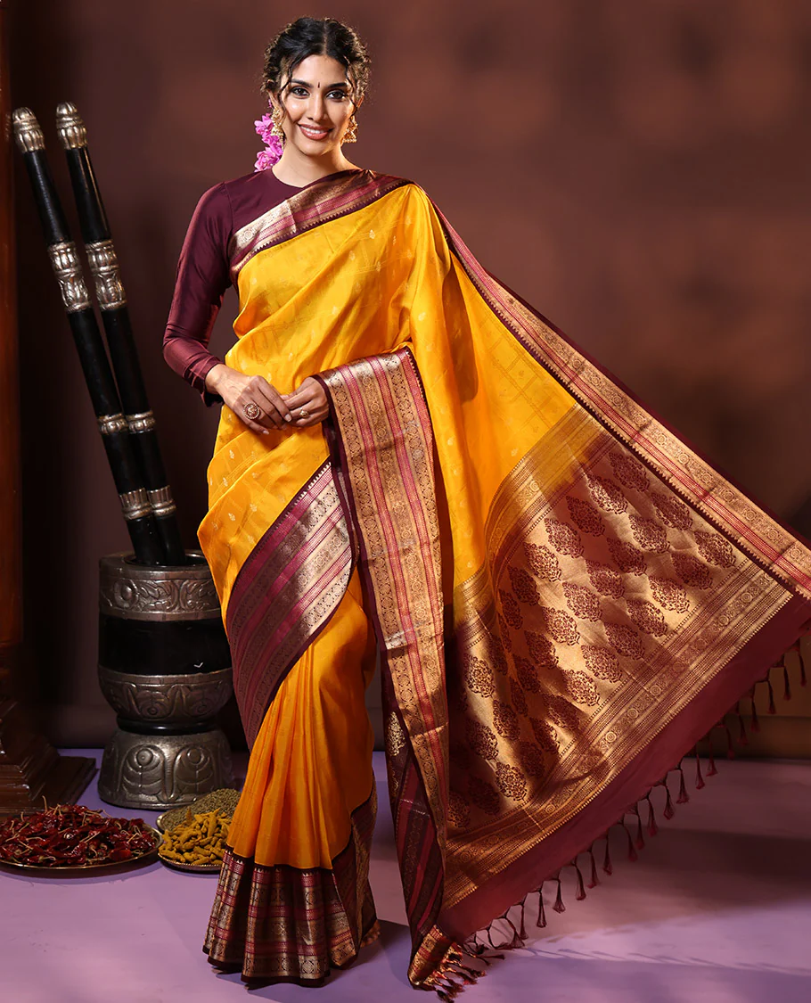 Yellow Vasundhara Silk Saree Subtly Sparkled with Buttas Enclosed Checks All Over Its Body, Complemented by Contrast Border of Rekku, Chakram, and Jada Nagam Designs, a Grandly Woven Pallu of Intricate Mughal Designs, and Paired with a Contrast Blouse - Image 6